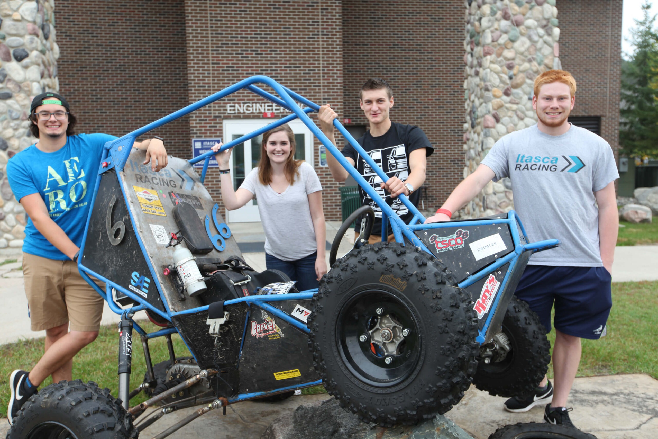 students standing around an ATV
