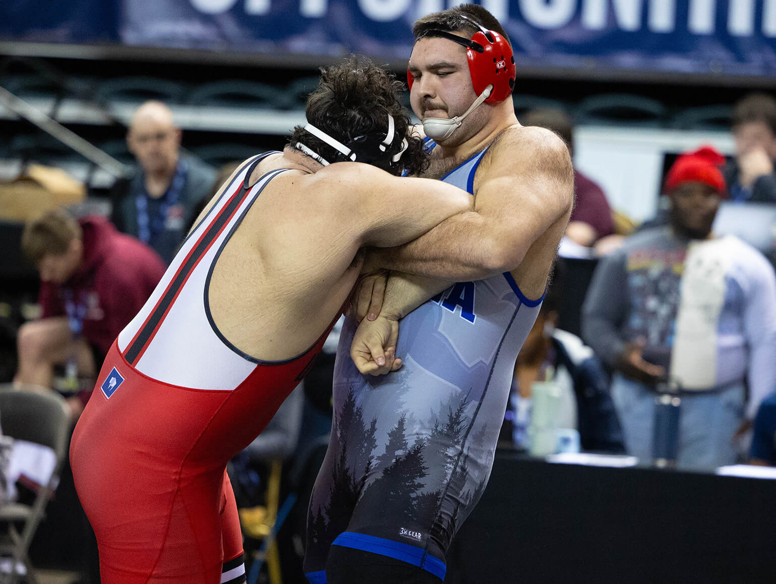 Itasca wrestler in wrestling match.