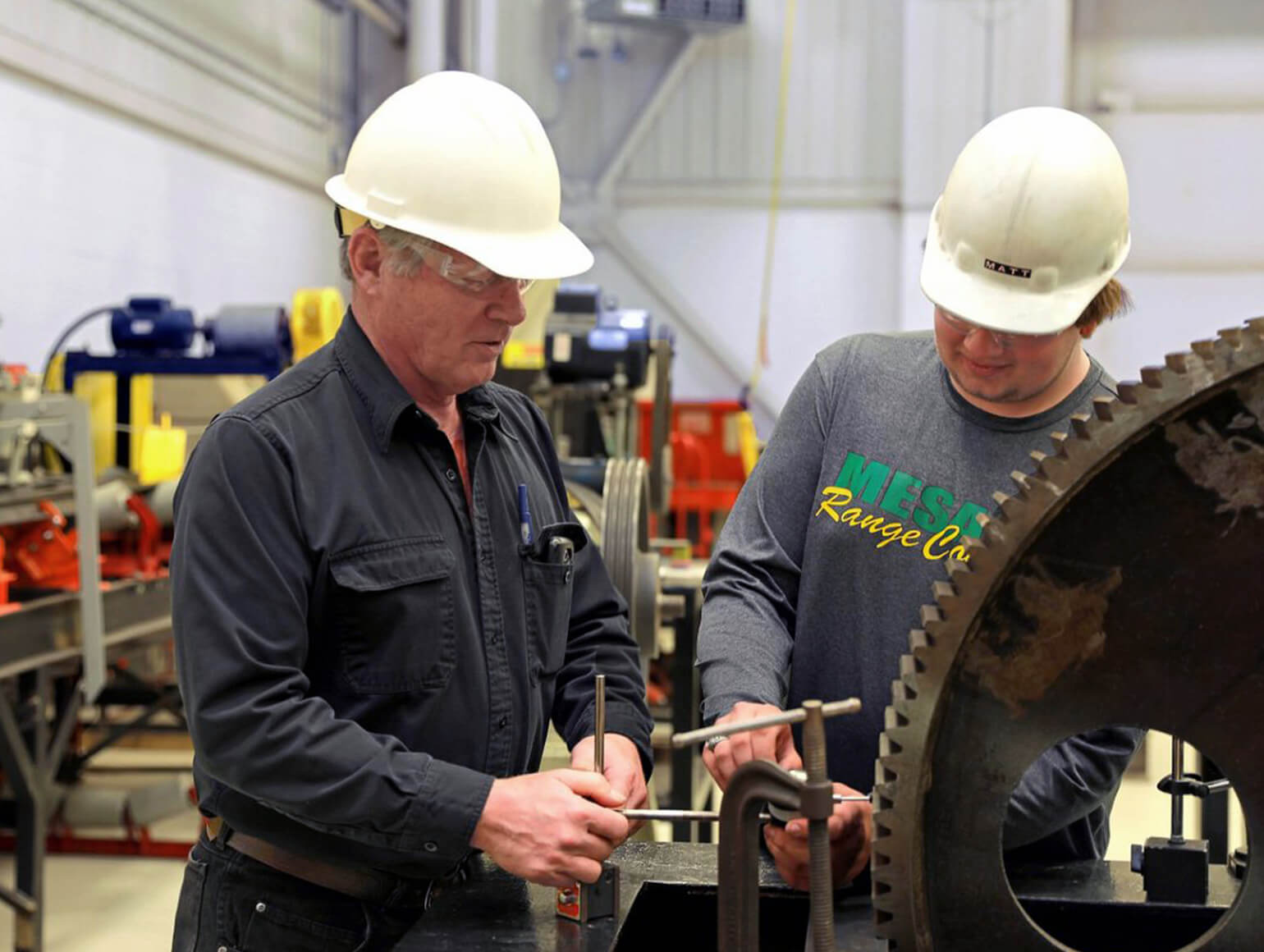 Instructor training student in the workshop.