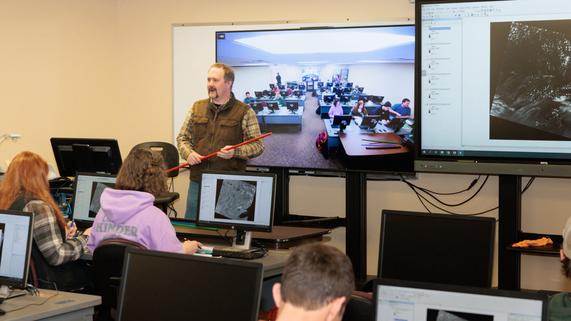 Teacher and students in geography class.