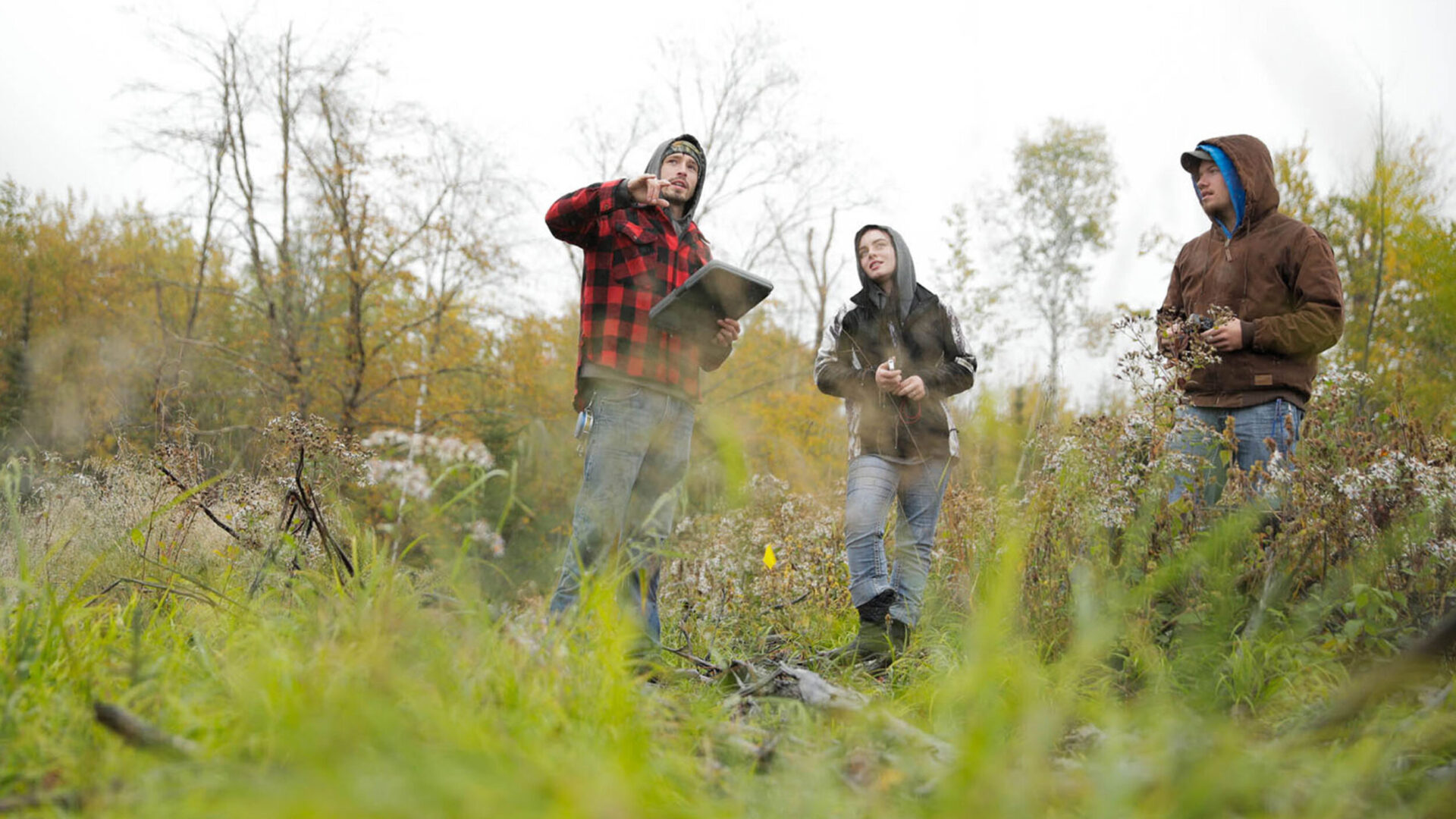 Students practicing land surveying.